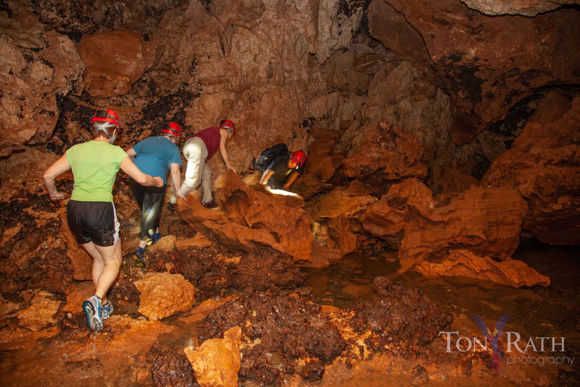 Group of people walking through the ATM cave
